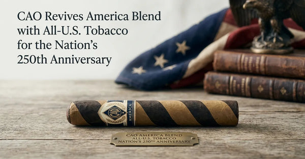 CAO America 250th Anniversary barber-pole cigar on a wooden surface.