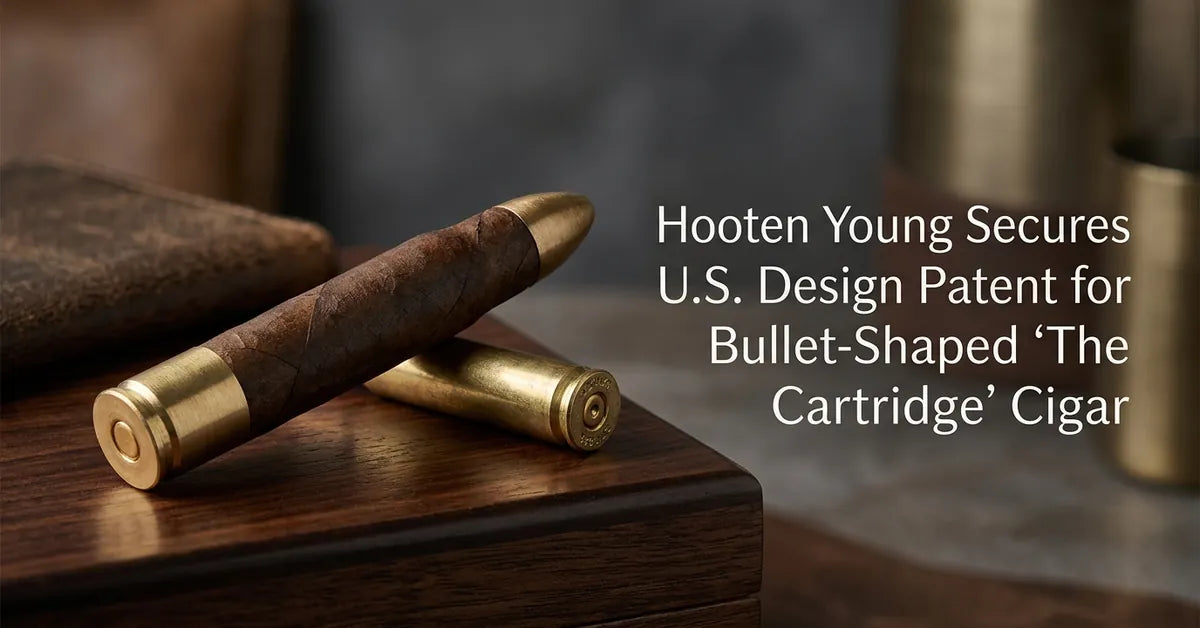 A Hooten Young 'The Cartridge' cigar shaped like a .50-caliber bullet resting on a wooden surface.