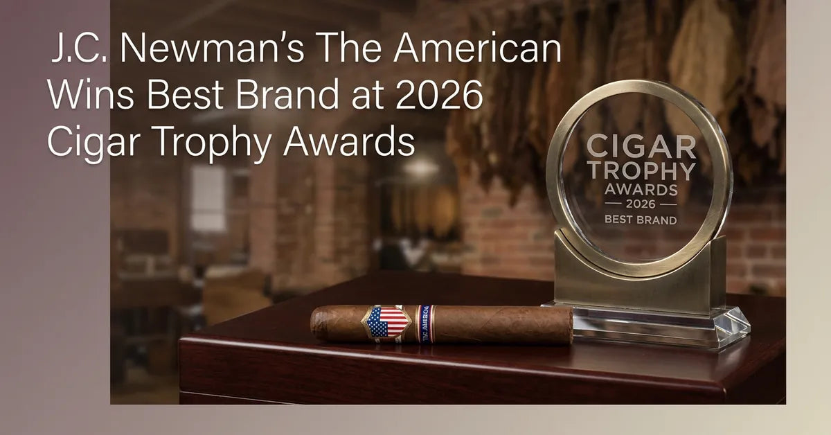 The American cigar by J.C. Newman resting on a wooden surface, representing its win at the 2026 Cigar Trophy awards.