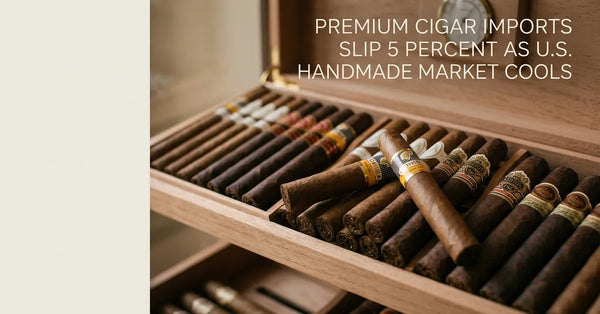 A close-up of premium handmade cigars resting in a wooden humidor.