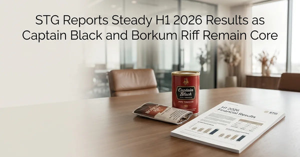 A tin of Captain Black pipe tobacco sitting next to a financial report on a wooden table.