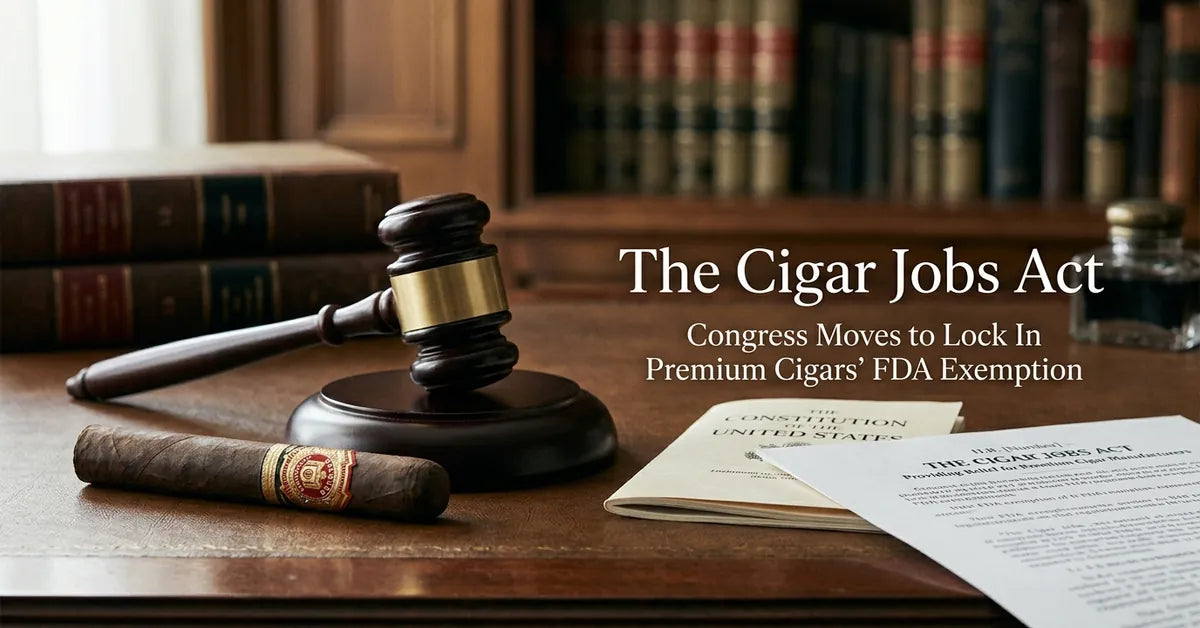 A premium cigar resting on a desk with a legal gavel, symbolizing the Cigar Jobs Act legislation.