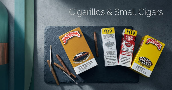 Backwoods Bold and Banana cigarillo packs beside Swisher Sweets packs on a slate board