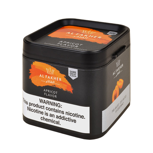 Close-up texture of Al Fakher Apricot red shisha molasses showing fine-cut Virginia tobacco