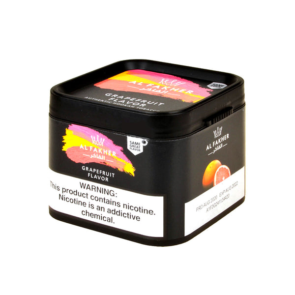 Close-up texture of Al Fakher Grapefruit Shisha Tobacco Molasses showing the fine cut and juicy consistency